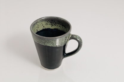Hand Finished Slip Made Small Tapered Coffee Mugs Decorated In Our Black Hole Glaze 1