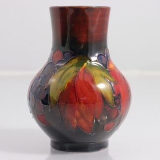 William Moorcroft Leaf and Berry Flambe Pottery Vase Impressed Mark W Moorcroft By William Moorcroft (England 1872-1945) 1