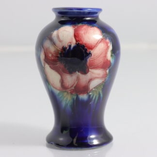William Moorcroft Pottery Anemone Pattern Vase in Blue Ground Impressed Marks W Moorcroft By William Moorcroft (England 1872-1945) 1