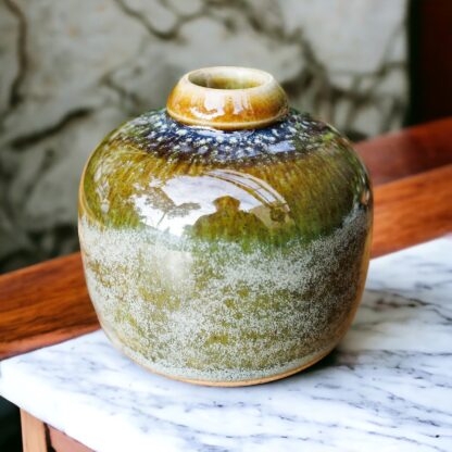 Hand Made Wheel Thrown Small Bottle Vase Decorated In Our Rutile Green Glaze With An Orange Cover 113