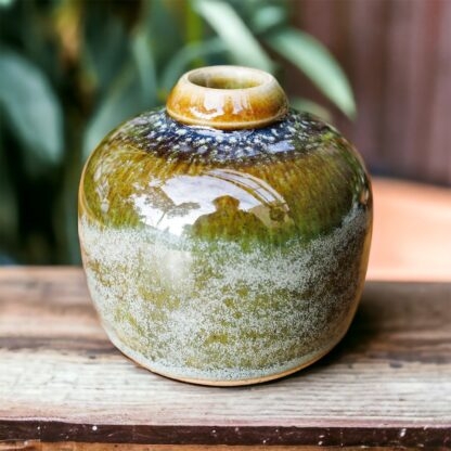 Hand Made Wheel Thrown Small Bottle Vase Decorated In Our Rutile Green Glaze With An Orange Cover 114