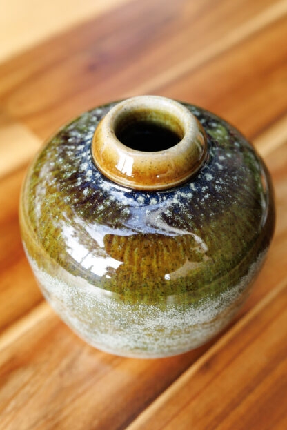 Hand Made Wheel Thrown Small Bottle Vase Decorated In Our Rutile Green Glaze With An Orange Cover 31