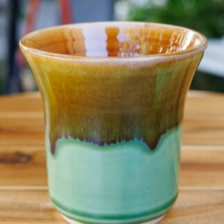 Wheel Thrown Vase Decorated In Our Light Green Base With An Orange Cover Glaze Hand Made In Melbourne