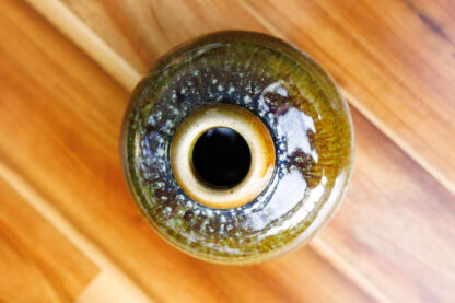 Hand Made Wheel Thrown Small Bottle Vase Decorated In Our Rutile Green Glaze With An Orange Cover 29