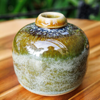 Hand Made Wheel Thrown Small Bottle Vase Decorated In Our Rutile Green Glaze With An Orange Cover 32