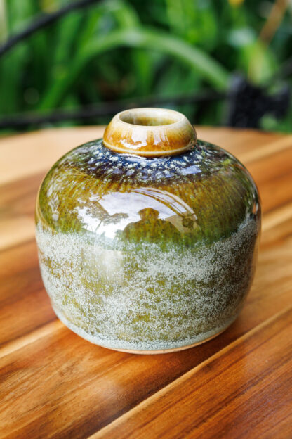 Hand Made Wheel Thrown Small Bottle Vase Decorated In Our Rutile Green Glaze With An Orange Cover 32